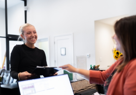 Woman talking to dentist about dental insurance coverage