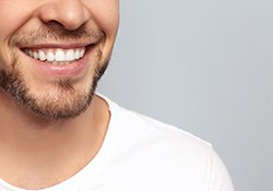 smiling man who knows the investment in cosmetic dentistry in Geneva was worth while
